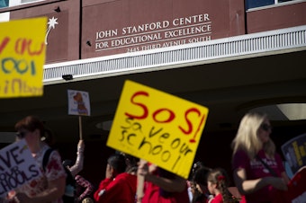 caption: Hundreds of Seattle Public Schools students and parents gathered for a rally demanding that schools remain open, ahead of the Seattle Public Schools board meeting on Wednesday, September 18, 2024, at the John Stanford Center for Educational Excellence building in Seattle. 