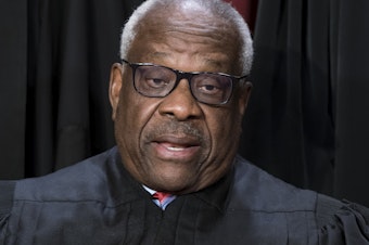 caption: Justice Clarence Thomas poses for a photo at the Supreme Court building in Washington on Oct. 7, 2022. Thomas told attendees at a judicial conference Friday that he and his wife have faced "nastiness and lies" over the last several years. He also decried Washington, D.C., as a "hideous place."