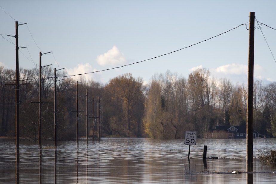 caption: A flooded portion of Francis Road is shown on Tuesday, November 16, 2021, in Clear Lake.