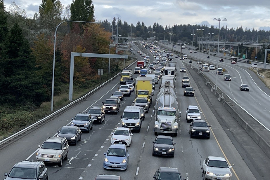 caption: Motor vehicles, like these stuck in traffic on Interstate 5 in Seattle on Oct. 17, 2024, are Washington's largest source of climate-damaging pollution.