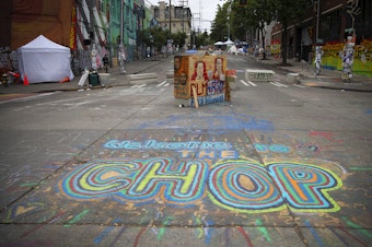 caption: The Capitol Hill Organized Protest zone, CHOP, is shown on Monday, June 29, 2020, in Seattle. 