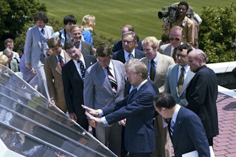 caption: Former President Jimmy Carter at the June 20, 1979 dedication ceremony for solar panels installed on the White House.