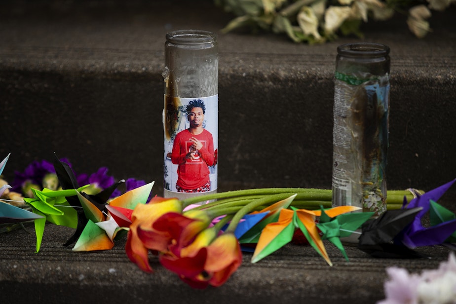 caption: A photograph of 17-year-old Garfield High School student Amarr Murphy-Paine is shown on a candle in a growing memorial for the student who was shot and killed, as students return to school for the first time since his death, on Tuesday, June 11, 2024, at Garfield High School in Seattle.  