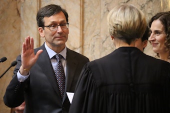 caption: Washington's 24th Governor, Bob Ferguson, takes the oath of office in Olympia Wednesday, Jan. 15, 2025.