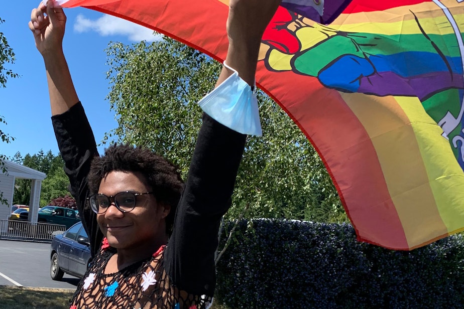 caption: The author, Rhea Beecher, at a recent pride parade.