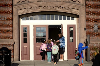 caption: Students arrive for their first day of school on Wednesday, Sept. 6, 2023, at Daniel Bagley Elementary School in Seattle. 