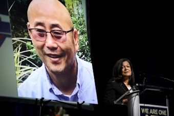 caption: U.S. Rep. Pramila Jayapal (D-Wash) talks to the audience who attended a memorial for Metro Transit Operator Shawn Yim in Seattle, Jan. 10, 2025.