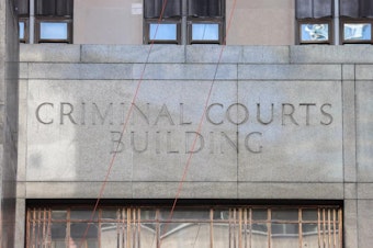 caption: A view of the Manhattan Criminal Court building in New York City in April.
