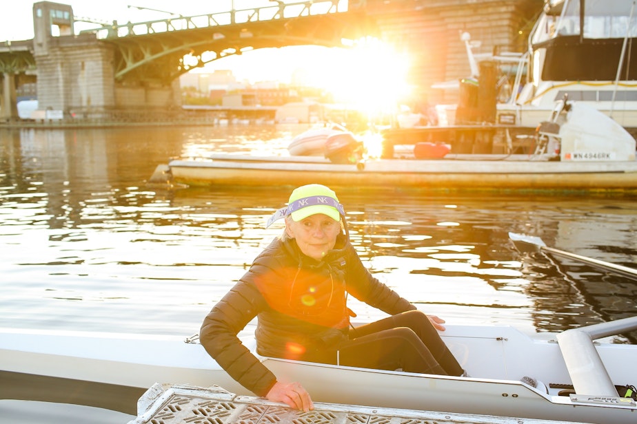 caption: Coxswain Alex O'Reilly prepares to go out on a morning row with her master's crew team at Pocock Rowing Club, September 16, 2021.