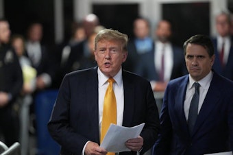 caption: Former U.S. President Donald Trump with attorney Todd Blanche speaks to the media during his trial for allegedly covering up hush money payments, at Manhattan Criminal Court on Tuesday in New York City.
