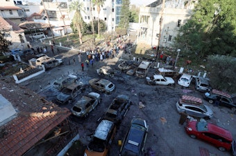 caption: A view shows an area of Al Ahli Arab Hospital where hundreds of Palestinians were killed in a blast. The blast area was relatively small but occurred in an area packed with Palestinian civilians.