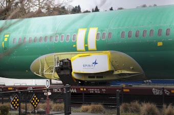 caption: Joshua Dean, who died on Tuesday, had gone public with his concerns about defects and quality-control problems at Spirit AeroSystems, a major supplier of parts for Boeing. Here, a Spirit AeroSystems logo is seen on a 737 fuselage sent to Boeing's factory in Renton, Wash., in January.