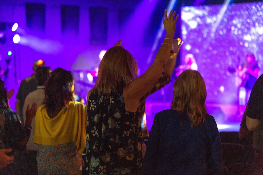 caption: Attendees worship at the Week of Awakening conference at Seattle Revival Center. The conference is linked to an August 2020 Covid outbreak with 28 cases and no deaths. 