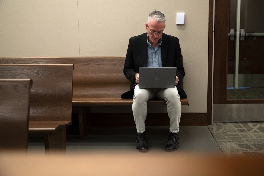 caption: Juvenile probation counselor Dan Baxter waits to speak with Judge Veronica Galván, not pictured, in juvenile court on Wednesday, August 14, 2024, at the Judge Patricia H. Clark Children and Family Justice Center in Seattle. 