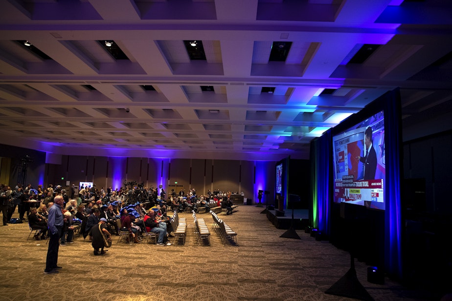 caption: Democratic supporters watch as presidential election results are projected on Tuesday, November 5, 2024, during the Washington Democrats election night party at the Seattle Convention Center in Seattle. 