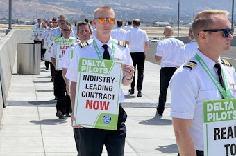 caption: Delta pilots engaged in demonstrations at seven airports around the U.S. on Thursday calling for higher pay, among other things. This photo was taken at Salt Lake City International Airport.