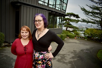 caption: Ex-spouses Lisa Jaffe (left) and Maura Hubbell stand for a portrait in front of Canlis restaurant in Seattle where they had their last date in 2015 following the finalization of their divorce. January 16, 2021. 