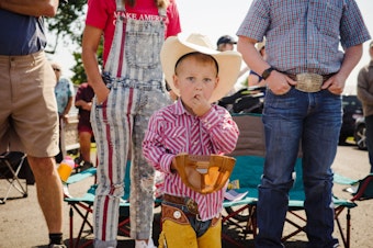 caption: Rural family fun at the Johnson Parade in 2023. 

