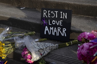 caption: ‘Rest in love Amarr’ reads a sign during a unity walk in honor of 17-year-old Garfield high school student Amarr Murphy-Paine, who was shot and killed at school, on Thursday, June 13, 2024, in Seattle. 