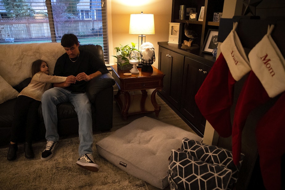 caption: Caileigh Mrsny, 7, left, sits with her brother, Cadence Mrsny, at their home on Thursday, December 9, 2022, in Puyallup. 