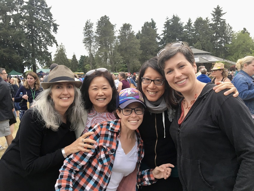 caption: Terri Chung, second from left, the author of this essay, with friends who like to hug at a ZooTunes concert in Seattle.