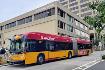 caption: A King County Metro RapidRide in the U District on Tuesday, October 8, 2024.