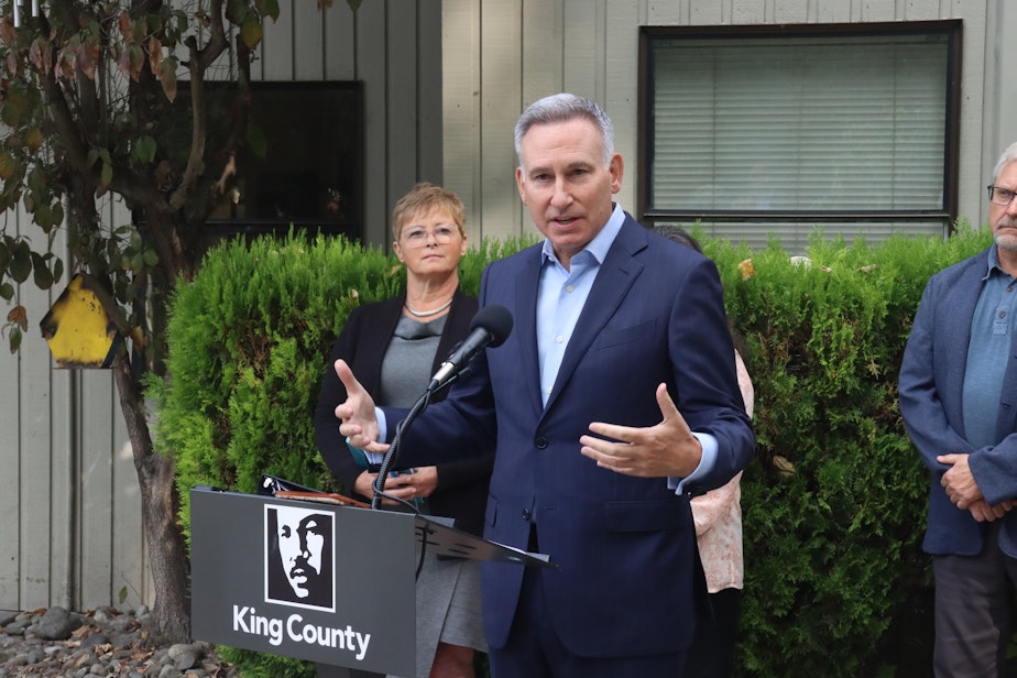 caption: King County Executive Dow Constantine announced Nov. 12, 2024, that he won't seek reelection when his term ends next year. In this 2022 photo, he announced the county's purchase of a residential treatment facility.