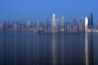 caption: Downtown Seattle is shown as the sun goes down on Tuesday, October 29, 2024, from West Seattle. 