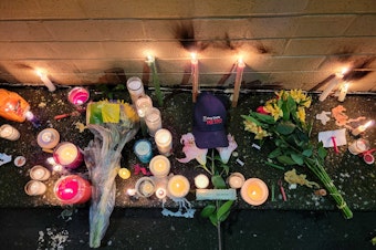 caption: Dozens of mourners gathered on Saturday, Dec. 21, 2024 for a vigil honoring slain King County Metro bus driver Shawn Yim. Yim, 59, was stabbed to death while driving his route near 15th Avenue Northeast and Northeast 41st Street in Seattle's U District neighborhood on Wednesday. 