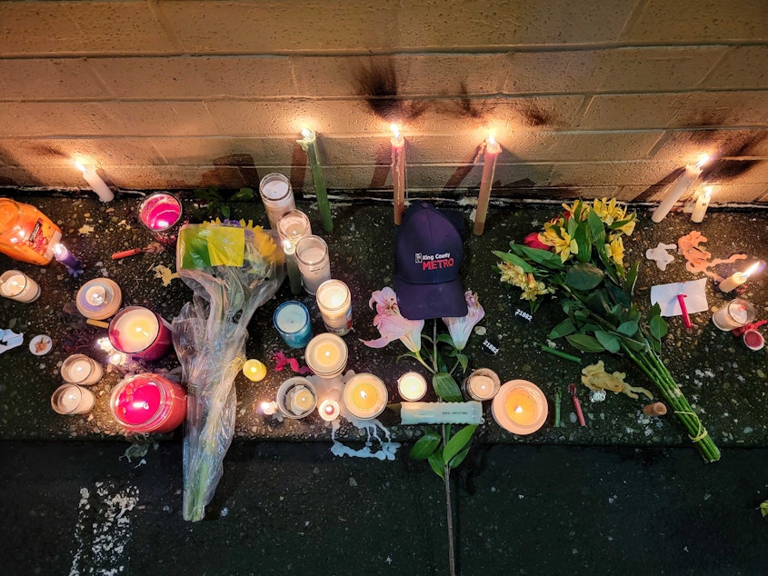 caption: Dozens of mourners gathered on Saturday, Dec. 21, 2024 for a vigil honoring slain King County Metro bus driver Shawn Yim. Yim, 59, was stabbed to death while driving his route near 15th Avenue Northeast and Northeast 41st Street in Seattle's U District neighborhood on Wednesday. 