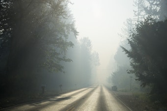 caption: Smoke from the Sumner Grade fire is visible on Wednesday, September 9, 2020, along Sumner Tapps Highway East in Sumner, Washington. 