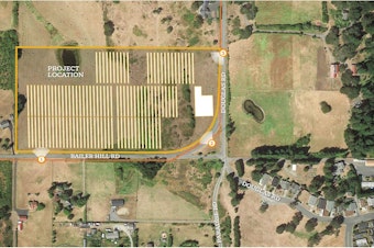 caption: An aerial depiction of a proposed solar power and battery-storage project on San Juan Island, Washington.