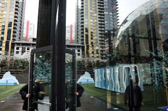 caption: Amazon employees returned to work en masse in downtown Seattle Thursday after a companywide policy went into effect requiring most workers to be in the office five days a week.