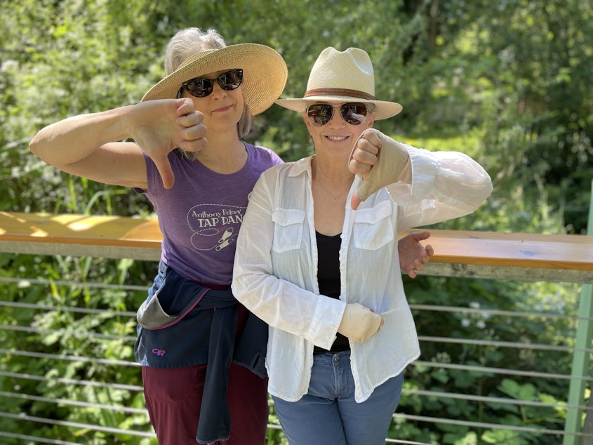 caption: Carol Dole (right) of Jackson Park and Rebecca Dietz (left) of Wedgewood demonstrate their reaction to the Supreme Court decision Friday overturning Roe v. Wade. 