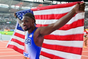 caption: Noah Lyles celebrates after anchoring the USA team to victory in the men's 4x100m relay final during the World Athletics Championships at the National Athletics Centre in Budapest on August 26.