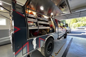 caption: Seattle Mountain Rescue truck’s equipment neatly organized and labeled into sections.