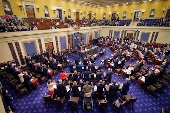 caption: An official Senate photographs shows senators taking the oath at the start of the Senate impeachment trial on Wednesday.