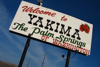 caption: A sign on Interstate 82 welcomes visitors to Yakima