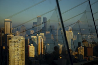 caption: Downtown Seattle is shown from the Space Needle on Monday, July 25, 2022. 