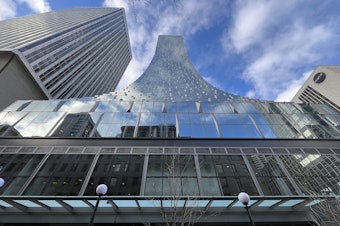 caption: Rainier Square Tower includes 189 apartments in its upper floors. 