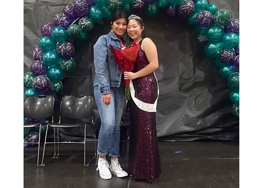 caption: Ella Chung, right, and a friend at homecoming in 2018. 