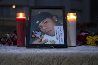 caption: A photograph of Jesse Sarey is shown at a small vigil outside of Saint Mark's Episcopal Cathedral on Thursday, June 3, 2021, in Seattle. Family members of those killed by Auburn police officer Jeffrey Nelson gathered to see their loved ones names projected as part of the “Projecting Justice” project - a collaboration between the ACLU of Washington, The Washington Coalition for Police Accountability, and Saint Marks.   