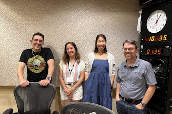 caption: Host Zaki Hamid is joined by Seattle Met's Allison Williams, KUOW's Joshua McNichols, and Seattle Times' Amanda Zhou.