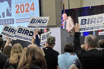 caption: Washington State Republican Chairman Jim Walsh speaks to party delegates at the state GOP convention on April 19, 2024, during a raucous vote to allow consideration of gubernatorial candidate Semi Bird for the party's endorsement.