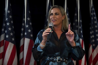 caption: Tiffany Smiley speaks to a crowd as primary election results come in on Tuesday, August 2, 2022, at the Hilton Garden Inn in Issaquah. At the time, Smiley was the Republican challenger of U.S. Sen. Patty Murray.