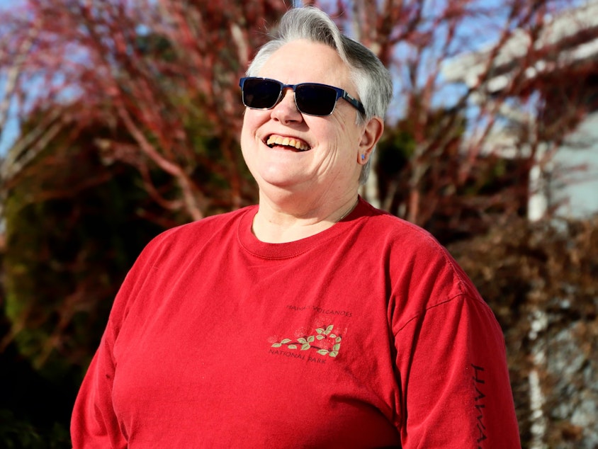 caption: Penny Maibie poses for a portrait outside her Maple Valley home.