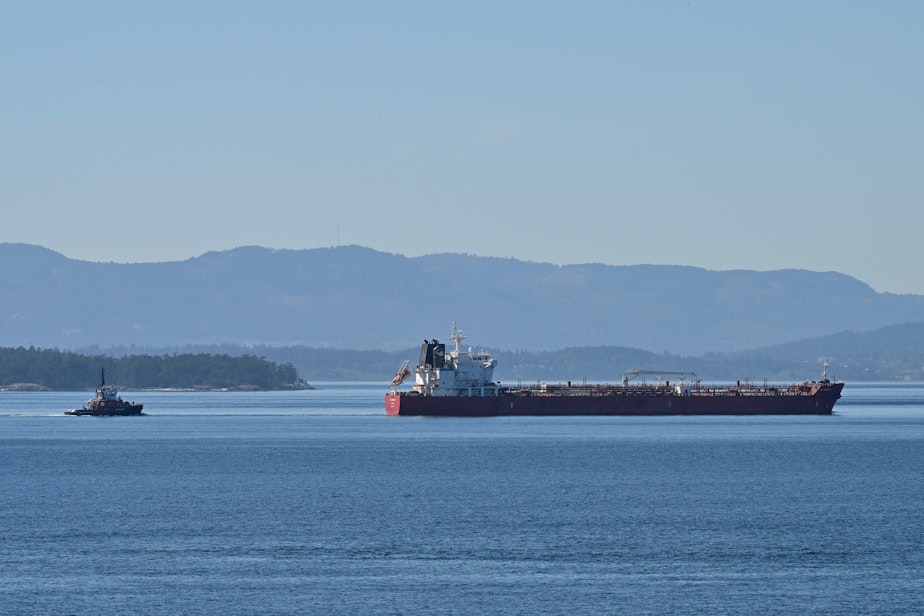 caption: The oil tanker STI Bronx and an escort tug motor up Haro Strait, between Washington's San Juan Island and British Columbia's Vancouver Island, on Aug. 29, 2024.