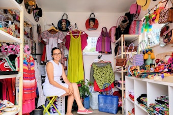 caption: Flor Moreno inside her shop, Aguacate Colors, at Pier 55 in Seattle on Tuesday, Aug. 13, 2024.