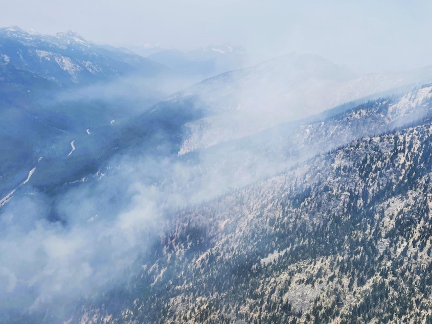 caption: Smoke from the Easy fire, burning in dense timber in the Methow Valley 17 miles west of Mazama, Washington.