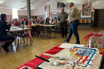 caption: State Sen. Drew MacEwen, a Republican candidate for Washington's 6th Congressional District, meets with voters at a "Candidate Oktoberfest" event in Port Angeles.